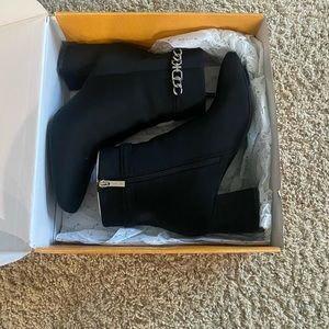 Woman’s size 9 Booties. Black. Worn 1 time for a wedding. UNISA brand. New $70